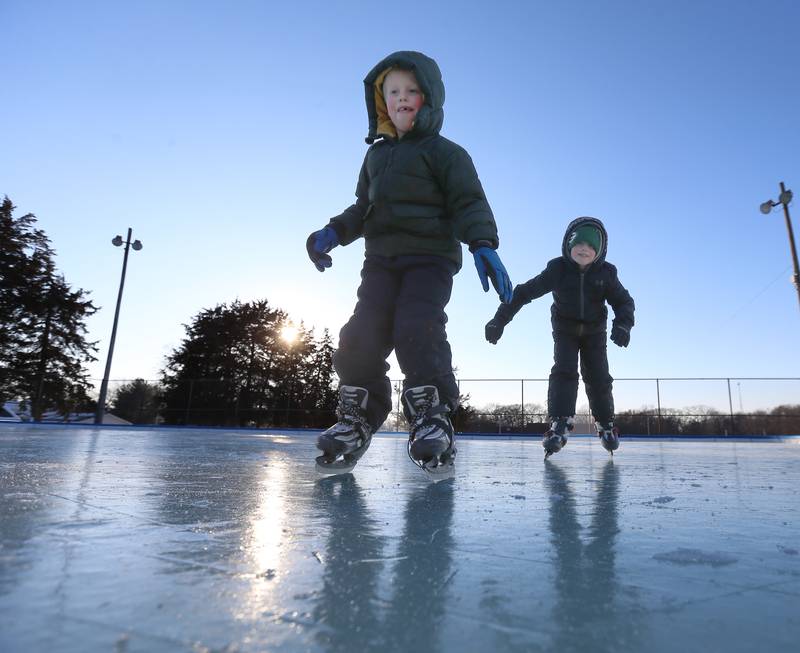 Griffin and Marshall Gray of Princeton skate on the ice rink at Alexander Park on Thursday, Feb. 2, 2023 in Princeton. The family spent the afternoon skating after school on the rink. Last December, The Princeton Park District Foundation purchased a portable EZ Ice Rink. The rink is located inside the fences at the tennis courts of Alexander Park. Admission to the ice rink will be free and each skater will be responsible for bringing their own skates. At this time, ice hockey will not be allowed as the district hopes to build on that in the future if things go well. The rink hours are 12p.m.-8p.m. Friday-Sunday and Monday-Friday 12p.m.-7p.m. Closures due to warm weather temperatures will be posted on the Princeton Park District website and Bureau County Metro Center Facebook page.