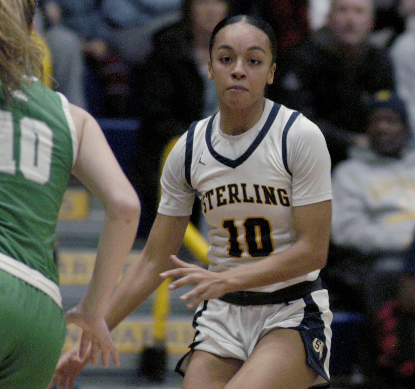 Sterling's Nia Harris faces off against Geneseo's Lizzie Raps. Sterling girls basketball hosted Geneseo at Musgrove Fieldhouse in Sterling. The action took place on Thursday, December 11, 2025.