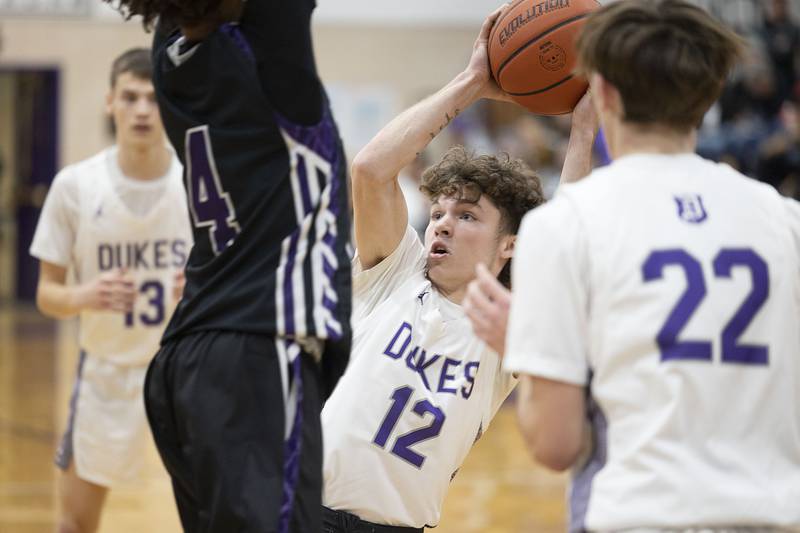 Dixon’s Jath St.Pier looks to pass against Rockford Lutheran Friday, Jan. 20, 2023.