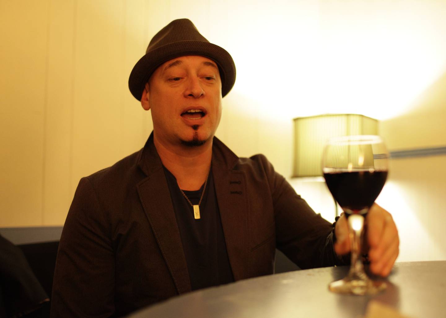 In this photo taken Wednesday April 11, 2012, Jimmy Stafford of the band Train samples some of their wine before their concert at the Great American Music Hall in San Francisco. (AP Photo/Eric Risberg)