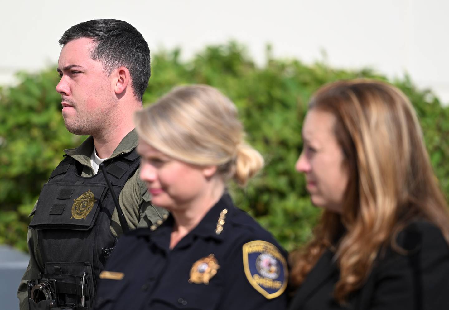 Det. Luke Weston looks on during the dedication ceremony for a monument to Kane County Sheriff's office police dog Hudson, killed in the line of duty last year. Weston was Hudson's handler.