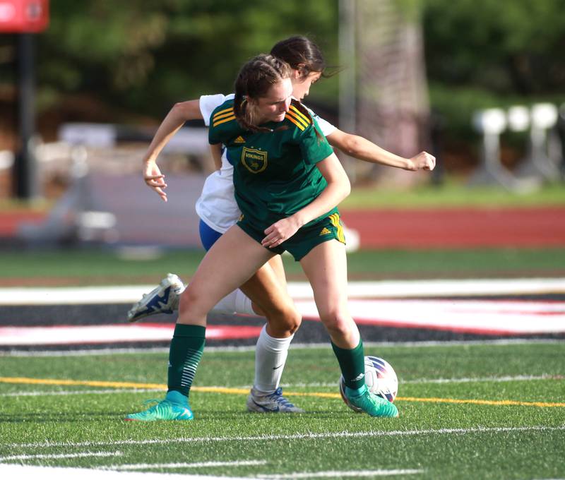 Fremd’s Ciera Ewanio gets tangled up with St. Charles North’s Aubri Magana during the Class 3A state semifinal game at North Central College in Naperville on Friday, May 31, 2024.