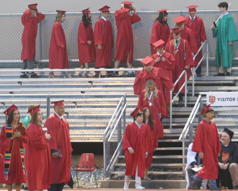 La Salle-Peru Township High School graduates walk to receive their diplomas during the L-P Class of 2026 commencement ceremony on Thursday, May 14, 2026 at Howard Fellows Stadium.