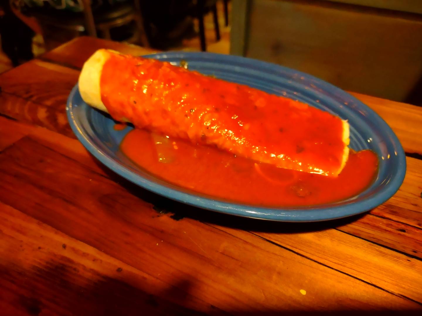 A steak burrito is covered in red sauce at La Fondita Mexican Grill in Ottawa.