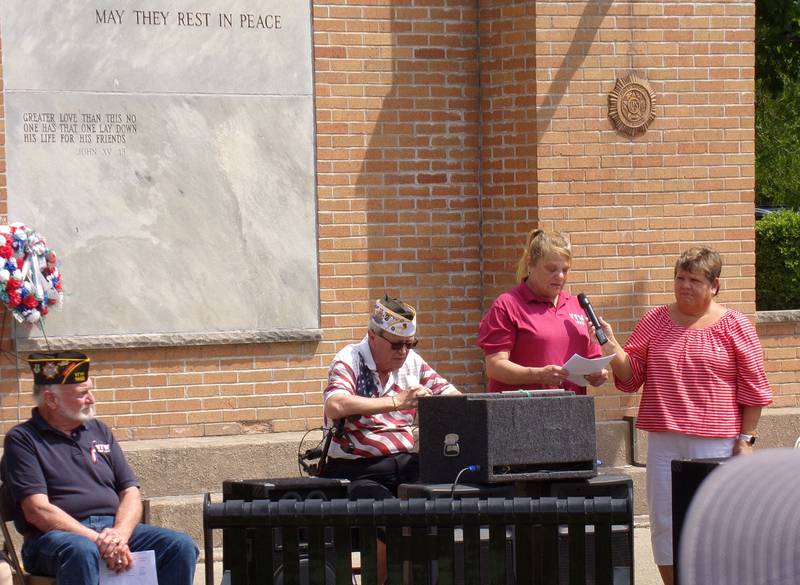 Jennifer Huber speaks Monday, May 30, 2022, to those in attendance at Veterans Plaza in City Park in Streator for the annual Memorial Day ceremony.