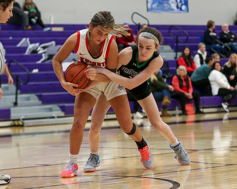 Lincoln Way Central's Gianna Amadio (15) battles Providence's Molly Knight (10) for possession in the WJOL Tournament Championship game. Nov 18, 2023.