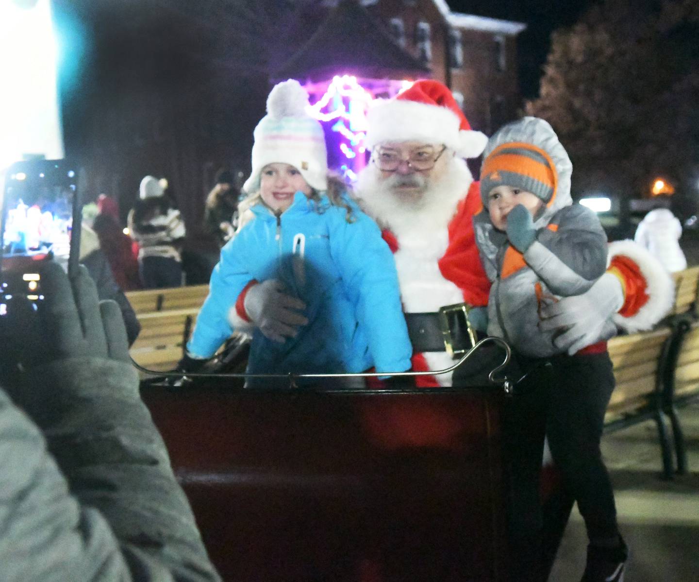 Eden and Luke White sit with Santa Claus at Mt. Morris' Festival of Lights on Dec.3. A visit with Santa was the main attraction at this year's event.
