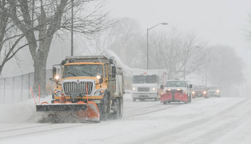 A plow clears snow from the eastbound lanes of Route 64 in St. Charles on Wednesday, Feb. 2, 2022.
