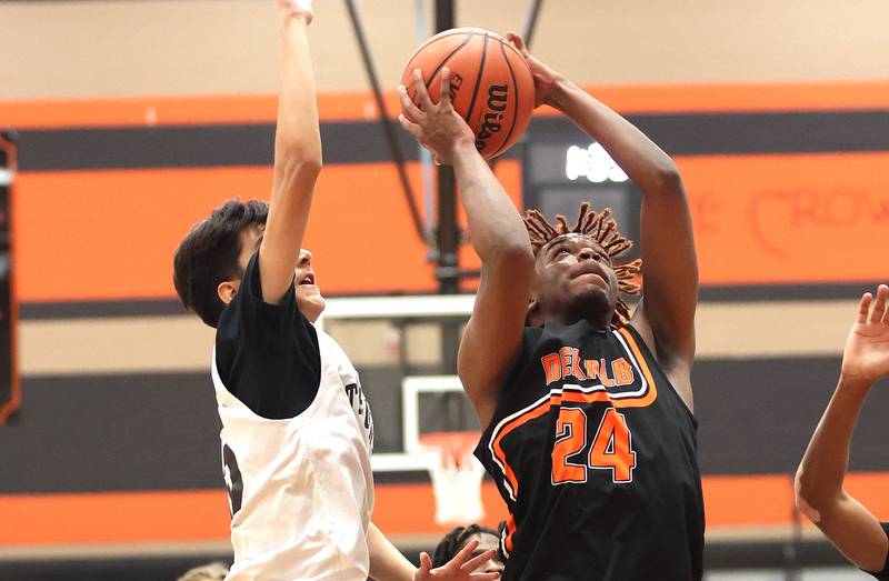 DeKalb's Alim Shah gets to the basket during their game with Streamwood Tuesday, June 6, 2022, in a summer tournament at DeKalb High School.