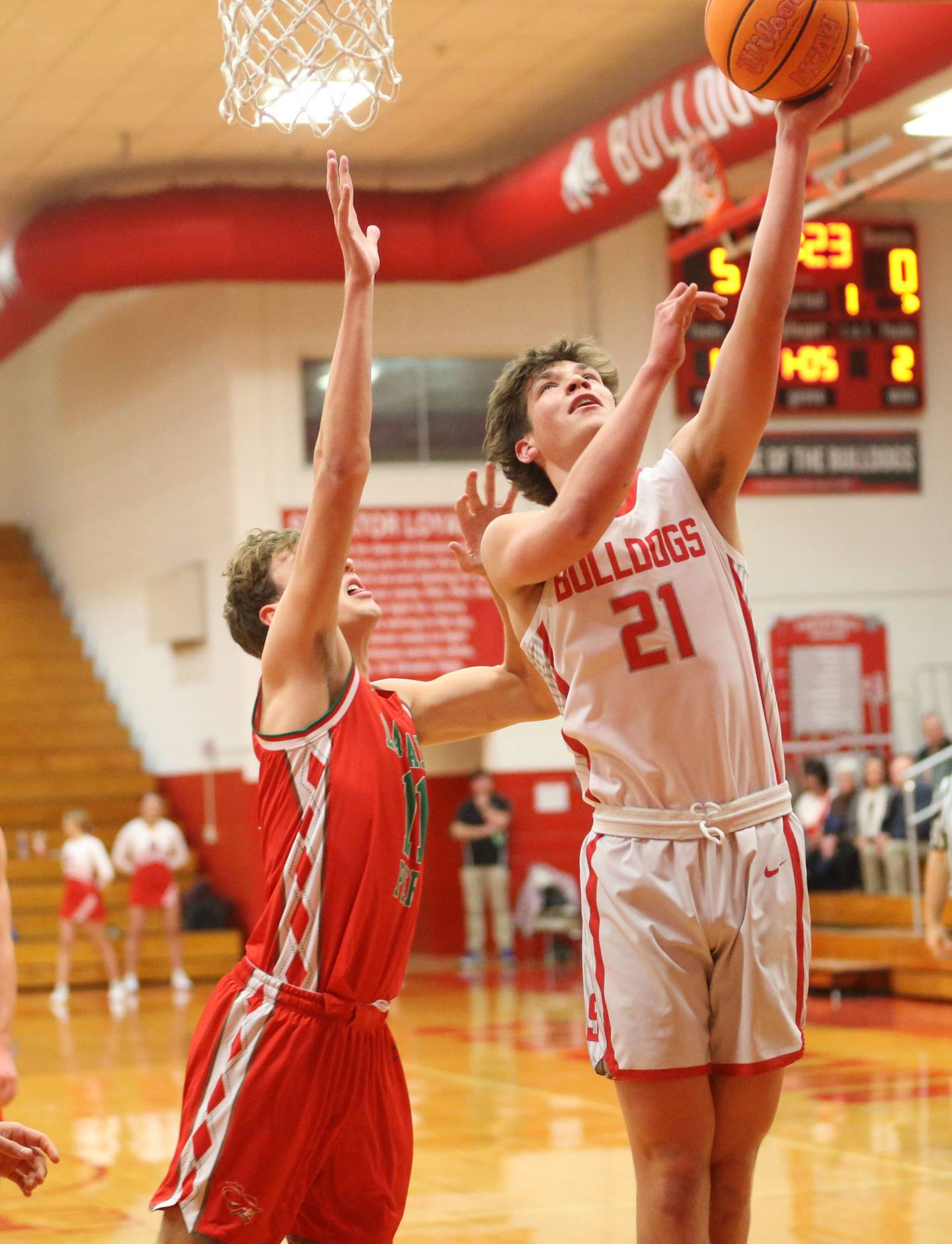 Streator's Brenen Stillwell scores on a layup over L-P's Jameson Hill on Tuesday, Jan. 13, 2026 in Pops Dale Gymnasium at Streator High School.