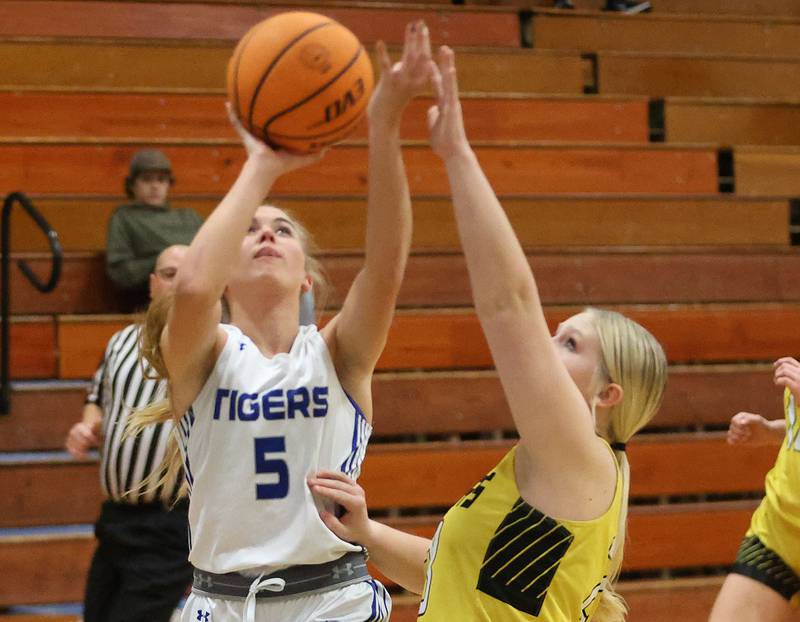 Princeton's Kiyrra Morris, eye the hoop as Putnam County's Emberlyn Cwikla, defends during the Tiger Girls Basketball Holiday Tournament on Tuesday, Nov. 18, 2025 at Princeton High School.