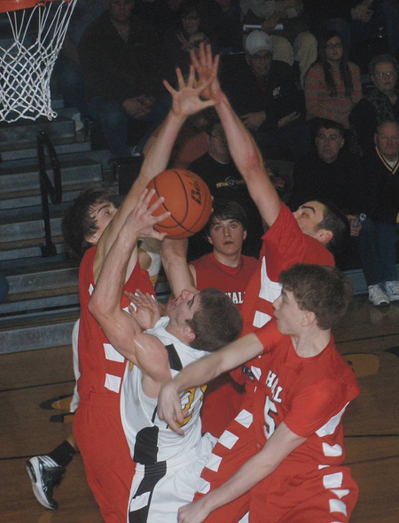 The Hall Red Devils did their best to try to surround Putnam County’s Harold Fay, but the Panthers sophomore guard went off for 31 points on 11-of-17 shooting from the field including four 3-pointers to lead the host Panthers to a 64-63 victory in the 2013 Tri-County Conference Tournament finals.