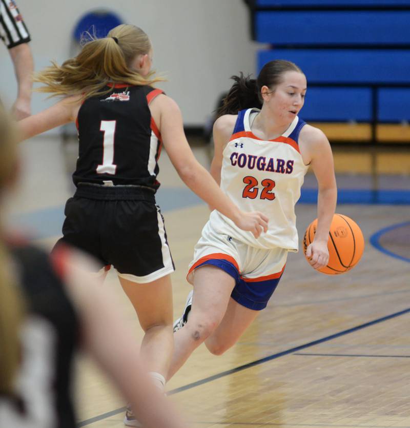 Eastland's Sienna Peterson (22) dribbles behind her back as she brings the ball up the court during a Friday, Dec. 13, 2024 game with Fulton at Eastland High School in Lanark.