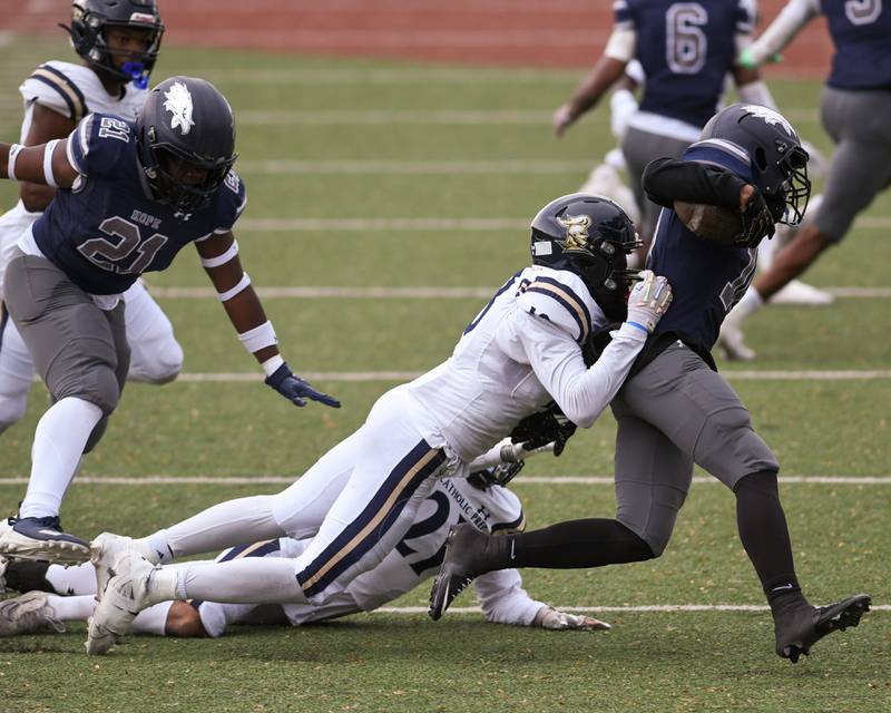 IC Catholic Prep's Jalen Banks, left, brings down Chicago Hope Academy Jacobi Henry (10) during the 3A Playoff game on Saturday Nov. 1, 2025, held at Altgeld Park in Chicago.