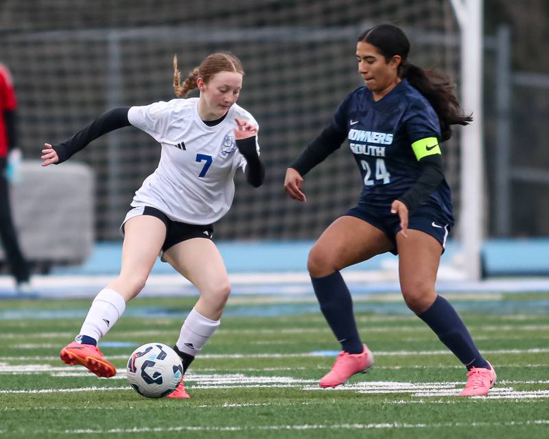 Riverside-Brookfield's Katherine Doyle (7) battles Downers Grove South's Marifer Duran (24) for possession during soccer match between Riverside-Brookfield at Downers Grove South.  April 10, 2025.