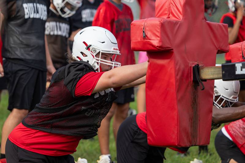Mason Clubb of Streator hits pad during practice on Monday, August 11, 2025 at Streator High School in Streator.