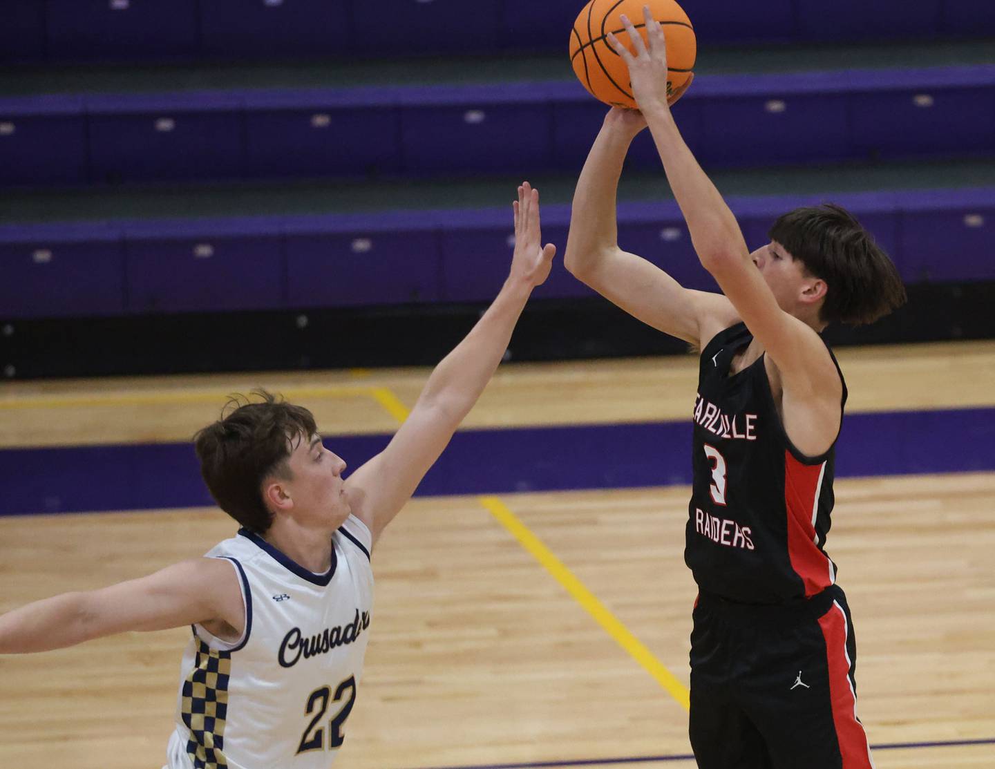 Earlville's Colton Fruit shoots a jump shot over Marquette's Griffin Dobberstein during the Huskers Hardwood Tip-Off Tournament on Tuesday, Nov. 25, 2025 in Serena.