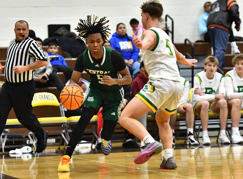 Plainfield Central's Treyvon Smith (5) drives down the baseline during the WJOL tournament game against Providence Catholic on Friday, NOV. 28, 2025, at Joliet.