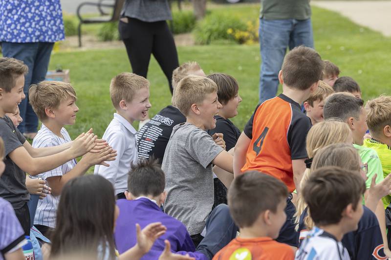 St. Anne School students react to the first pie in the face given to PE teacher Steve Caudillo on Friday, May 5, 2023.