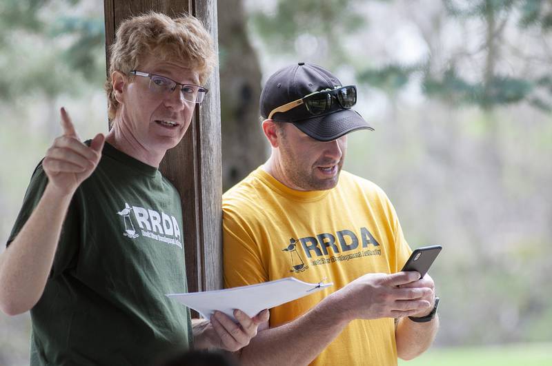 James Marks (left) and Kyle Sommers of the Rock River Development Authority worked to organize the volunteers for this years canal clean up day on Saturday, April 23, 2022.