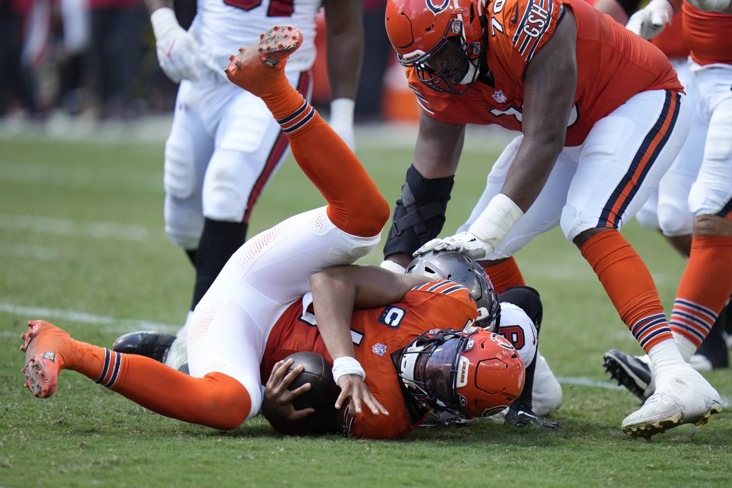 Chicago Bears quarterback Justin Fields is sacked by Tampa Bay Buccaneers linebacker Joe Tryon-Shoyinka during the second half, Sunday, Sept. 17, 2023, in Tampa, Fla.