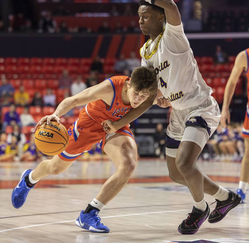 Eastland’s Parker Krogman works against Peoria Christian’s Josh Walton Thursday, March 13, 2025, during the Class 1A boys basketball state semifinal.