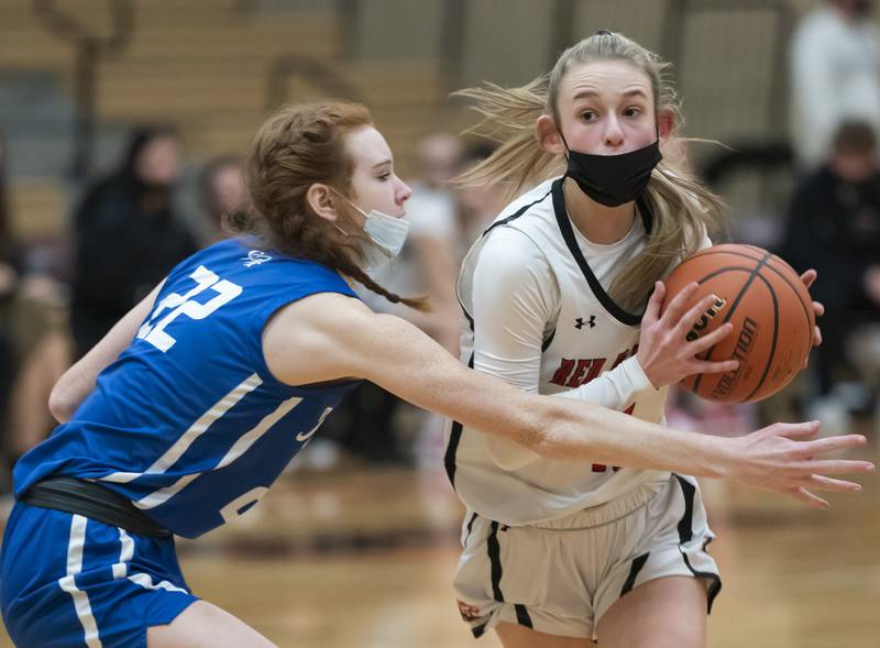 Huntley's Anna Campanelli looks to pass as Burlington Central's Paige Greenhagel defends during their game on Saturday, January 29, 2022 at Huntley High School. Huntley won 52-49.