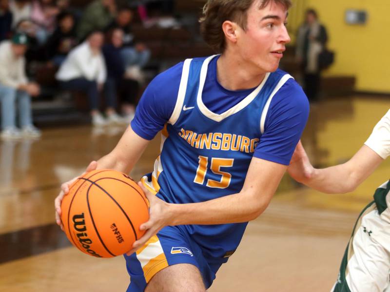 Johnsburg’s Ashton Stern moves the ball against Boylan in varsity boys basketball Hinkle Holiday Classic action on Tuesday, Dec. 23, 2025, at Jacobs High School in Algonquin.