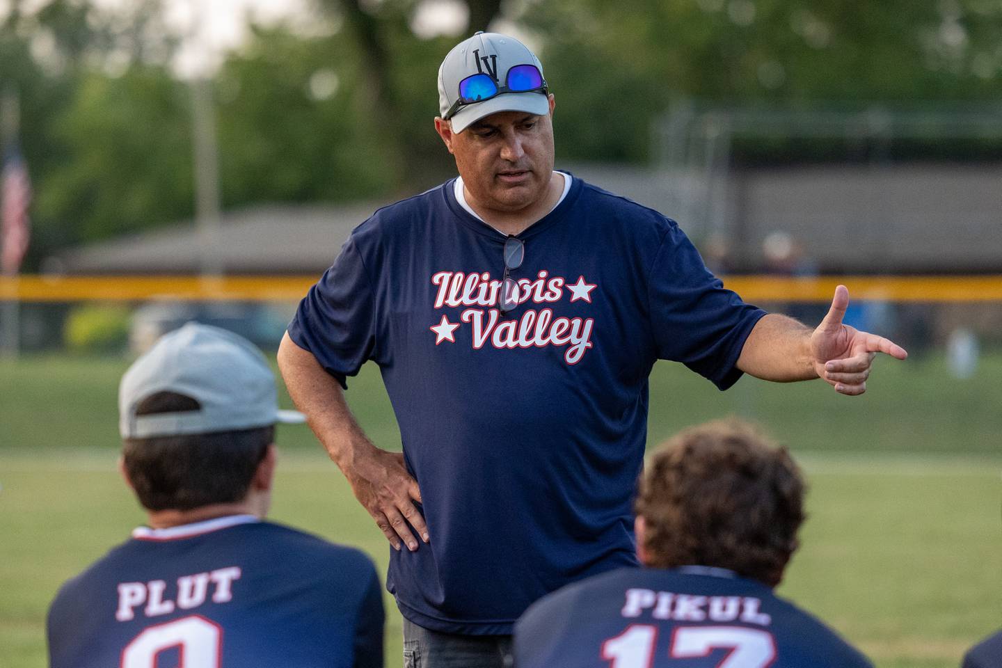 Coach Scott Pescetto of Illinois District 20 talks to team after loss to Iowa on Saturday, July 12, 2025 at Washington Park in Peru.