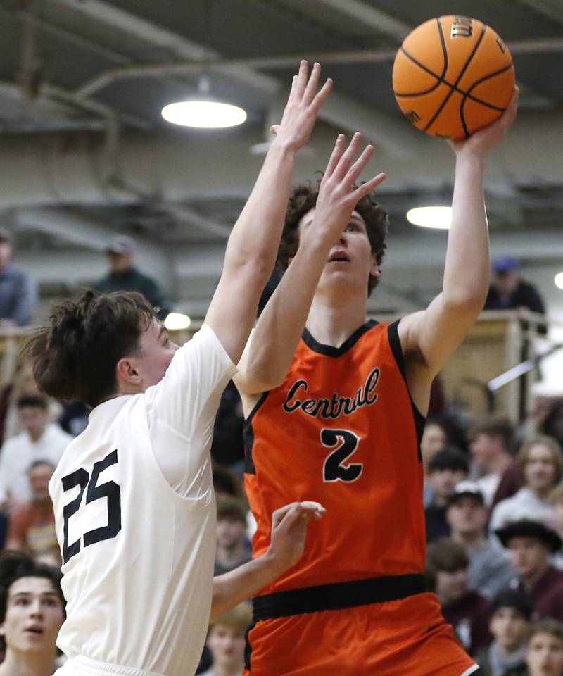 Crystal Lake Central's Danny Spychala drives to the basket against Prairie Ridge's Owen Voight during an IHSA Class 3A Prairie Ridge Regional basketball game on Monday, Feb. 24, 2025, at Prairie Ridge High School.