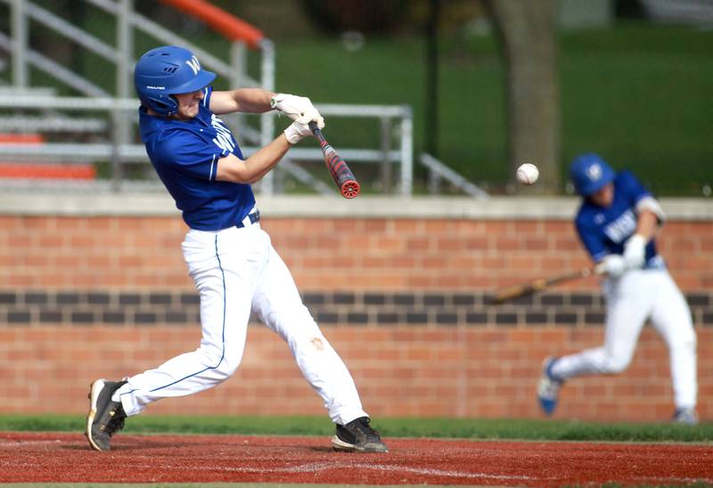 Wheaton North's Luke Bellini makes contact during a game against St. Charles East on Wednesday, April 23, 2025 in St. Charles.