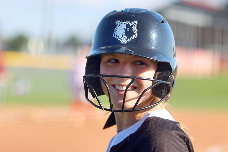 Prairie Ridge’s Ady Kiddy grins as she prepares to hit  in varsity softball at Huntley High School in Huntley on Monday, May 5, 2025.