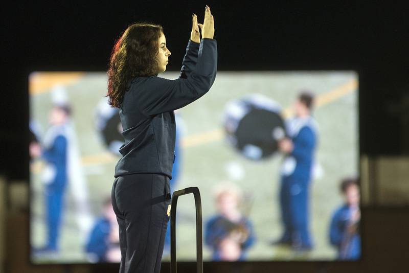 Sterling drum major Avery Knowles directs her squad during the half-time show Friday, Aug. 26, 2022. High school football opened their season this evening.