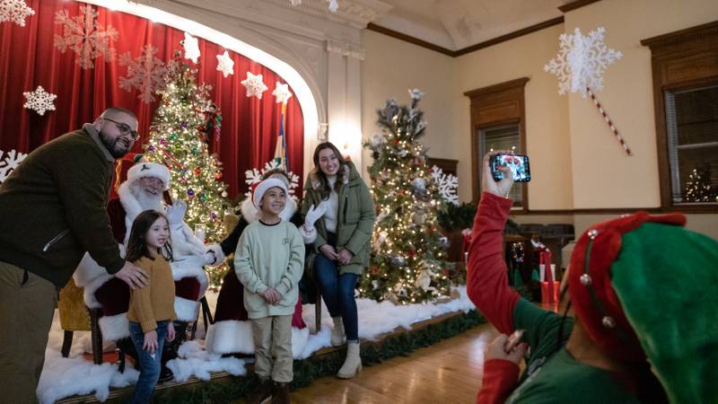 Family pictures with Santa and Mrs. Claus at Christmas during Christmas festivities in La Grange on Saturday, Dec. 3, 2022.