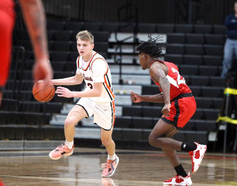 St. Charles East’s Jack Borri (3) dribbles down court during a game against East Aurora in the 63rd Annual Ron Johnson Thanksgiving Tournament at St. Charles East on Monday, Nov. 21, 2022.