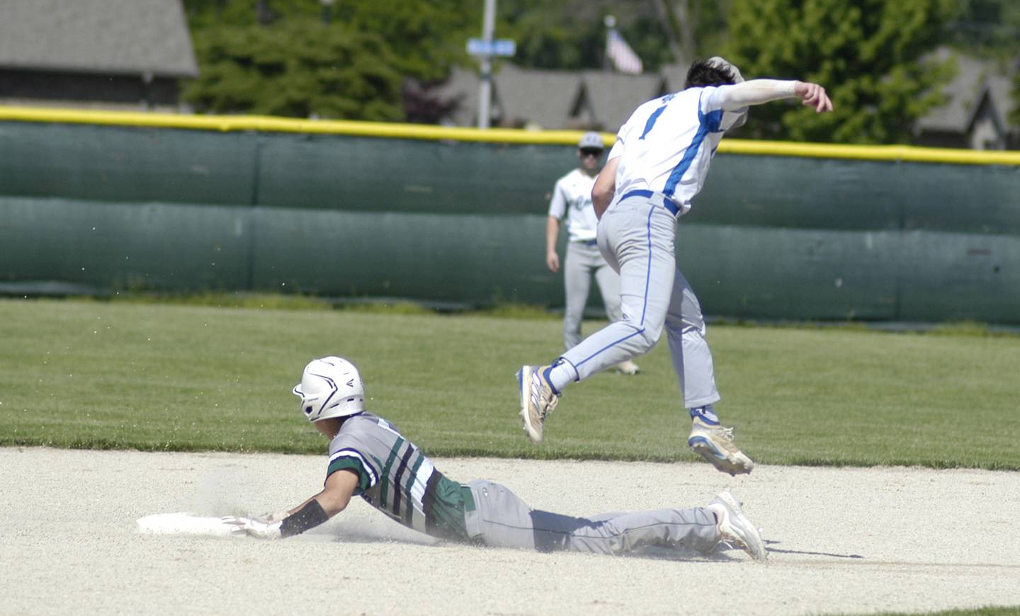 A RF player slides into second as Newman SS Garret Matznick misses the tag. The action took place in the 2A Regional baseball game at Larry Ybarra field at Newman High School, Saturday, May 18th 2024.