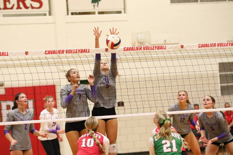 Rochelle's Audyn Kemp (5) goes high for a block during the Hubs' match with La Salle-Peru.