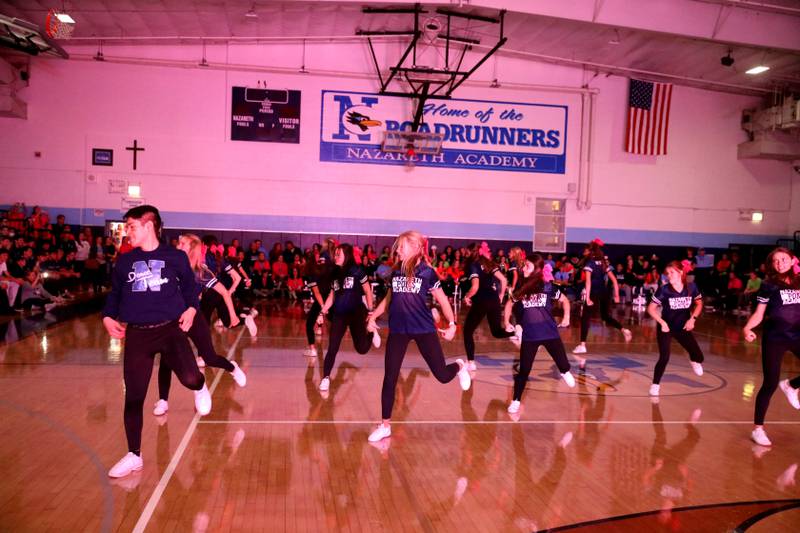 Nazareth Academy poms and dance team members perform during a homecoming pep rally at the La Grange Park school on Friday, Sept. 30, 2022.