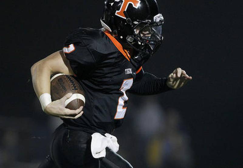 Cyrstal Lake Central senior Kyle Lavand runs the ball in for a touchdown during the third quarter of the high school football game against Grayslake North Friday, October 4, 2013.