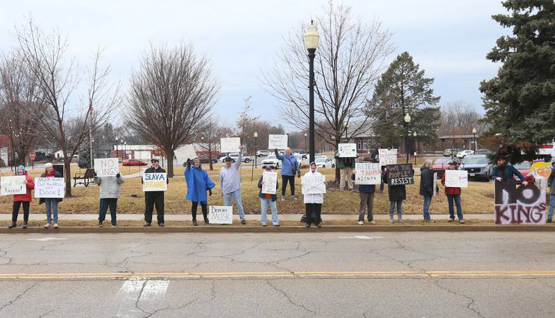 Dozens of citizens gather during a March 4 Democracy on Tuesday, March 4, 2025 at Rotary Park in Princeton. Participants brought signs to feature issues of concern for the county, state and country. The event was sponsored by concerned citizens of Bureau County.