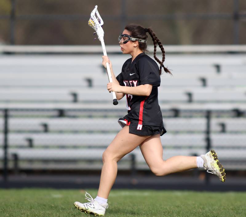 Huntley’s Meya Soto races with the ball in varsity girls lacrosse on Friday, April 18, 2025, at Metcalf Field on the campus of Crystal Lake Central High School in Crystal Lake.