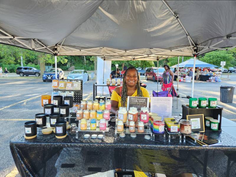 Tanesha Thompson, owner of L.I.T. Candles (L.I.T. is the acronym for "love, inspiration, transformation), is seen with her homemade products at the Independence Celebration on Thursday, July 3, 2025, at the Billie Limacher Bicentennial Park & Theatre in Joliet. Thompson also holds self-care seminars to teach the power of self-love.