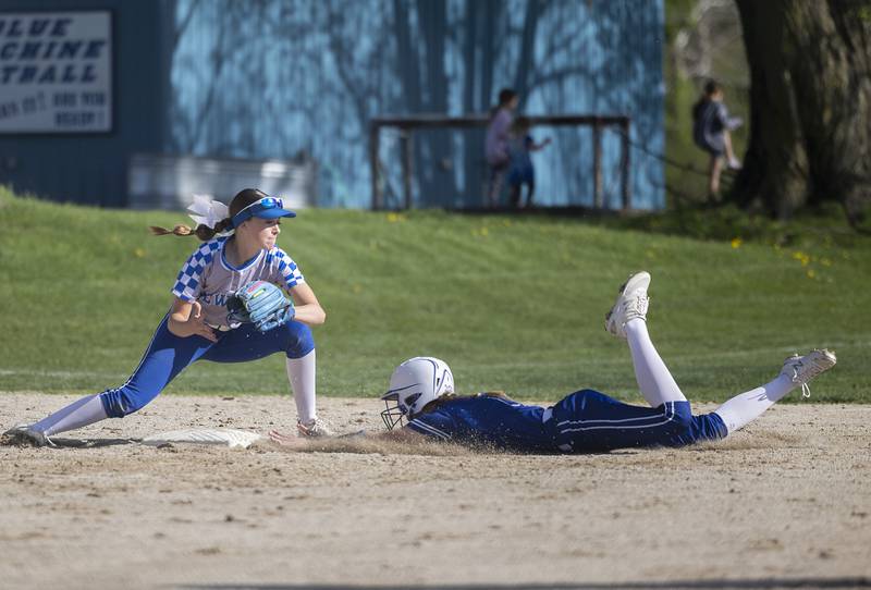 Princeton’s Caroline Keutzer slides in safe at third against Newman’s Brenleigh Cook Monday, April 29, 2024.