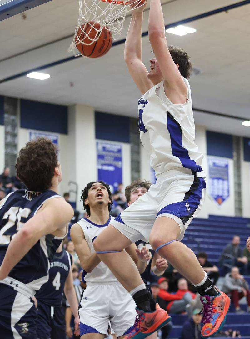 Riverside Brookfield's Stefan Cicic (14) dunks during the boys varsity basketball game between IC Catholic Prep and Riverside Brookfield in Riverside on Tuesday, Jan. 24, 2023.
