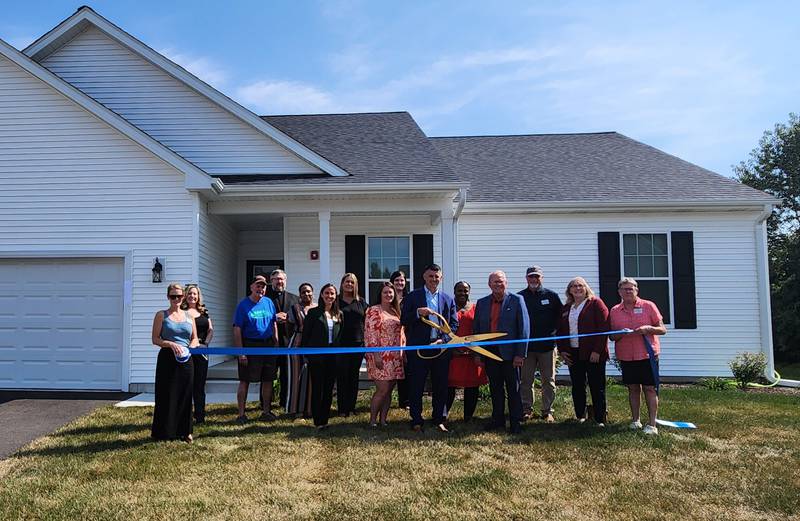 The Genoa Area Chamber of Commerce welcoming Opportunity House with a ribbon-cutting