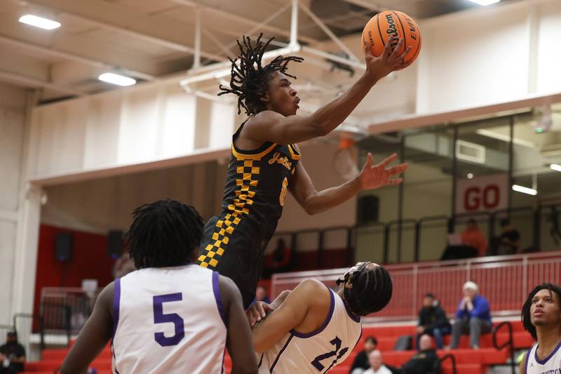 Joliet West’s Aamir Shannon draws the shooting foul against Thornton in the MLK Dream Classic at Homewood-Flossmoor on Monday, Jan 19, 2026 in Homewood.
