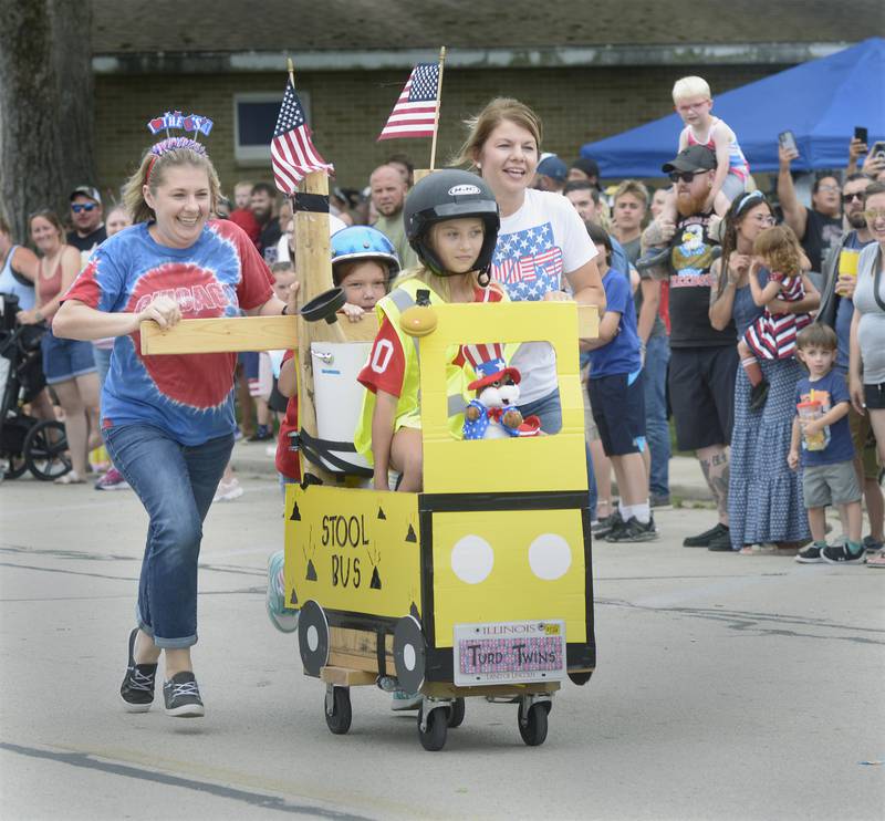eam Stool Bus races towards the finish line Thursday in Sheridan during the annual Toilet Bowl Races as part of the towns 4th of July celebration.