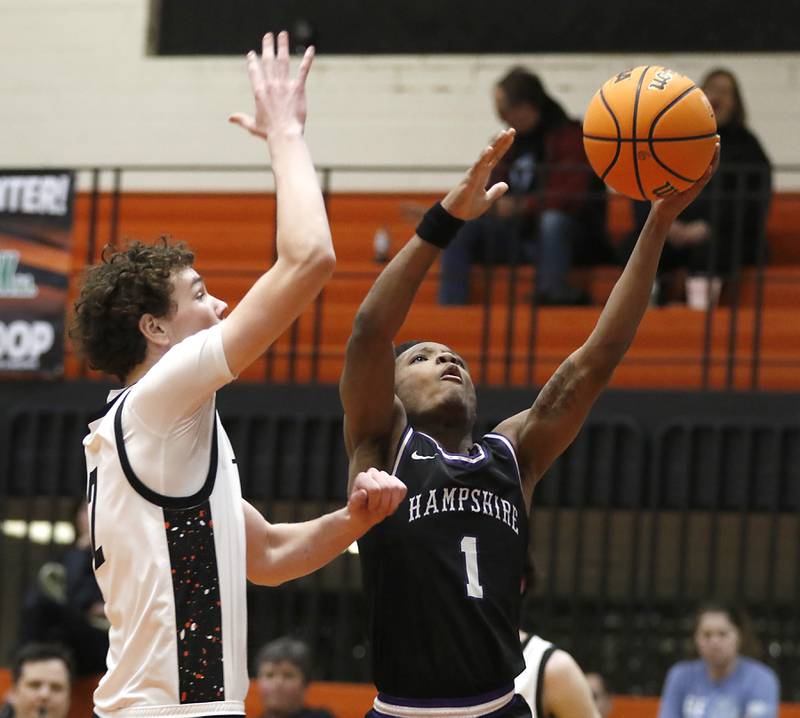 Hampshire's Chayse Gray drives to the basket in front of Crystal Lake Central's Danny Spychala during a Fox Valley Conference basketball game on Friday, Feb. 7, 2025, at Crystal Lake Central High School.