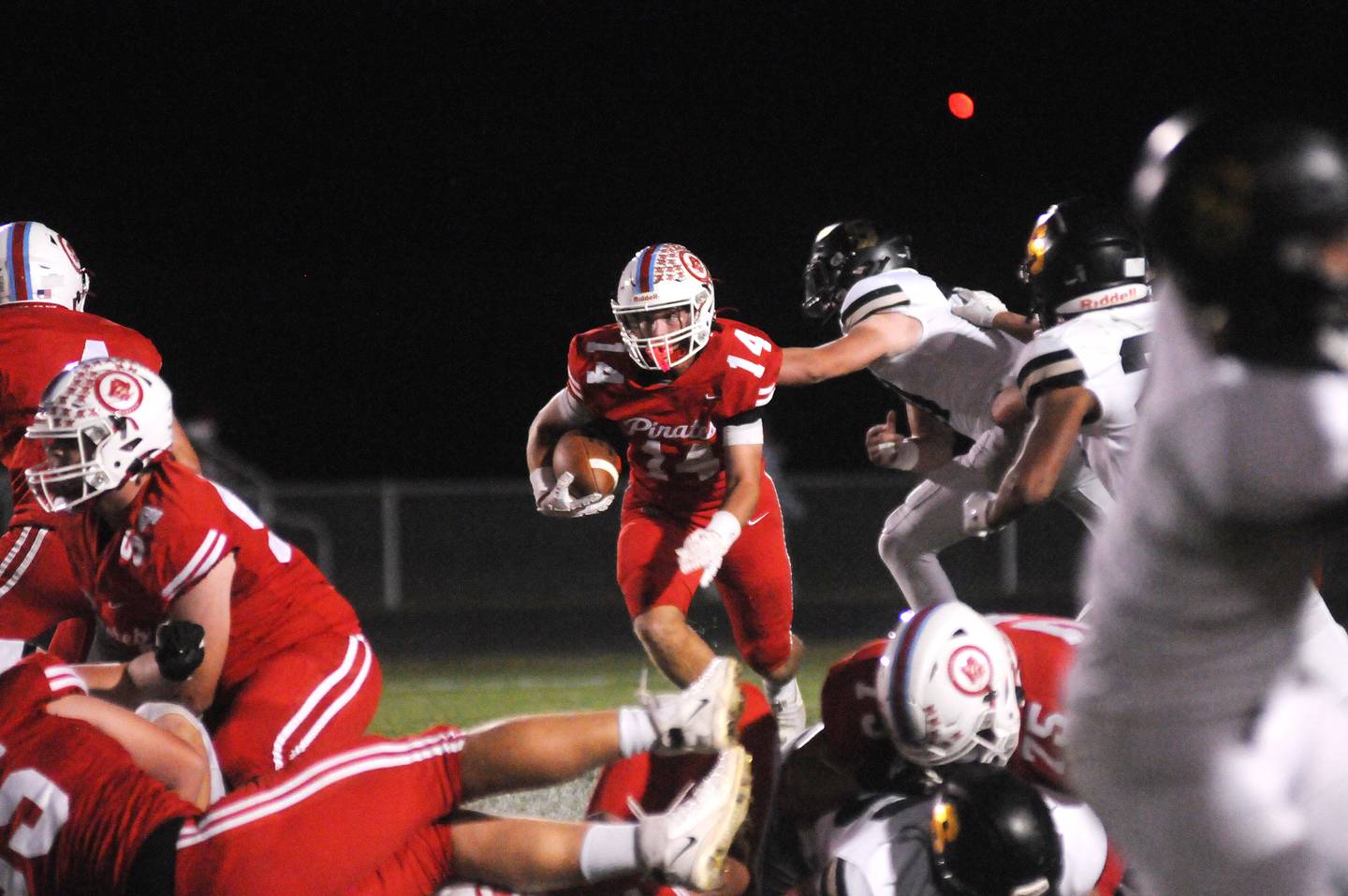 Ottawa senior Archer Cechowiz (14) eyes an opening for additional yardage against Sycamore on Friday, Sept. 26, 2025 at King Field.