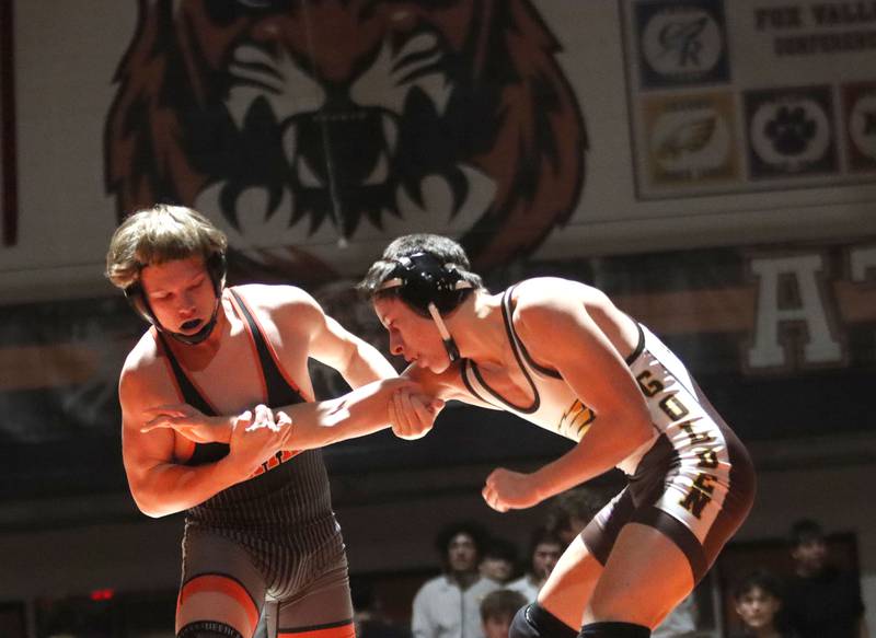 Crystal Lake Central’s Nate Kozlowski, left, battles Jacobs’ Daniel Delbosque  at 157 pounds in varsity boys wrestling on Tuesday, Jan. 20, 2026 at Crystal Lake Central High School in Crystal Lake.